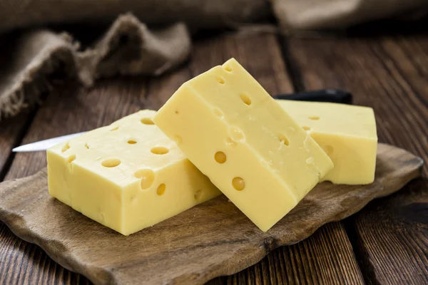 Cheese  on vintage wooden background — Stok fotoğraf