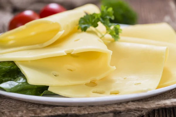 Sliced Cheese on vintage wooden background — Stock Photo, Image