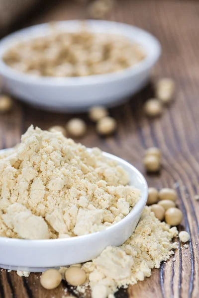 Some Soy Flour on old wooden table — Stock Photo, Image