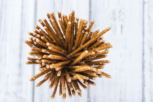 Salt Sticks on bright wooden background — Stockfoto