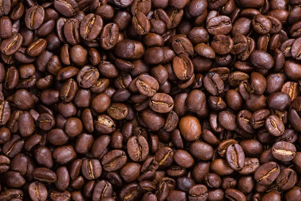 Geroosterde koffiebonen achtergrond — Stockfoto