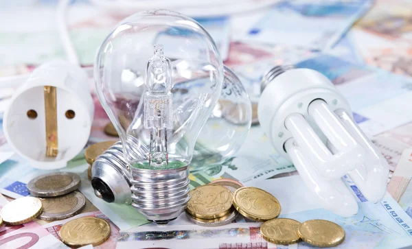 Light Bulbs on banknotes — Stock Photo, Image