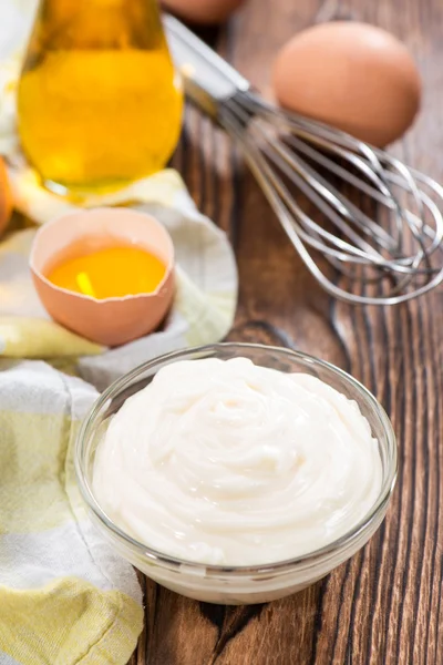 Portion of Mayonnaise on an old wooden table — Stock Photo, Image