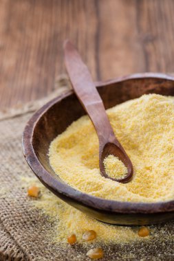 Cornmeal (on rustic background) clipart
