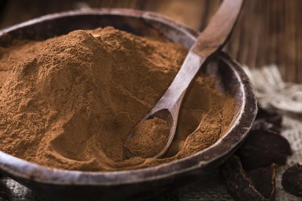 Cola mutter pulver på trä bakgrund — Stockfoto