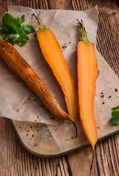 Some Baked Carrots on vintage background — Stock Photo, Image