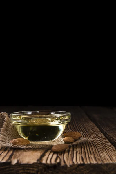 Bowl with almond oil — Stock Photo, Image