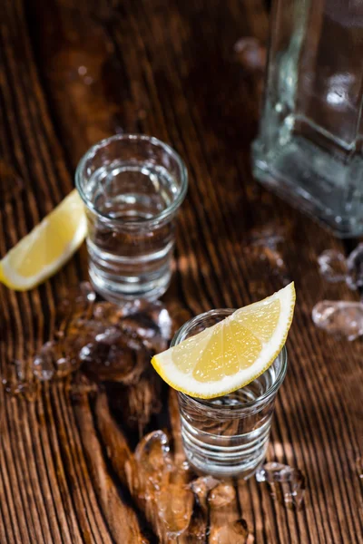 Vodka on the rocks on table — Stock Photo, Image