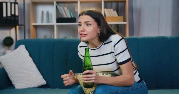 Close up of lovely happy excited young woman which celebrating victory of favourite team during revision sport game on TV at home with hands up ,leisure concept — Stock Video