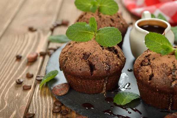 Chocolate muffins with mint — Stock Photo, Image