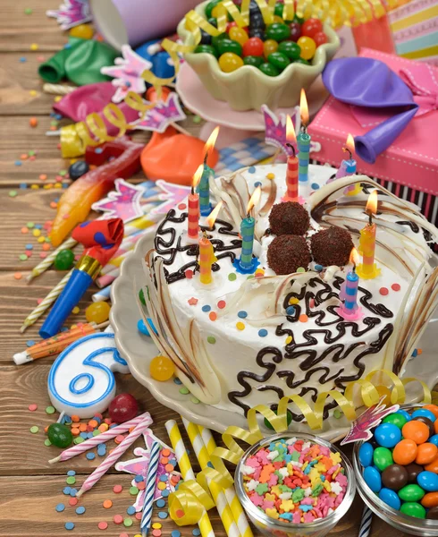 Birthday cake and various accessories — Stock Photo, Image