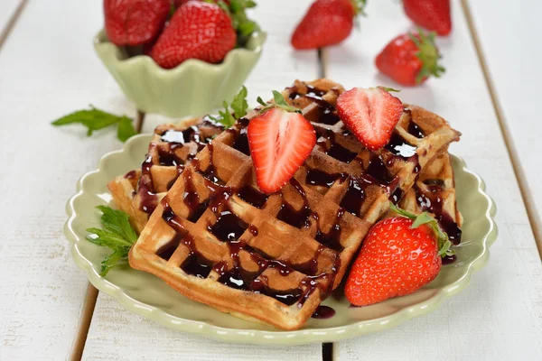 Waffles with topping and strawberries — Stock Photo, Image