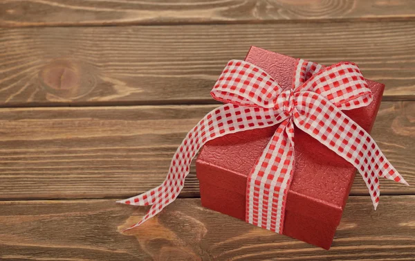 Red box decorated with ribbon — Stock Photo, Image