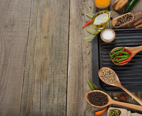 Frying pan, spices and seasonings — Stock Photo, Image