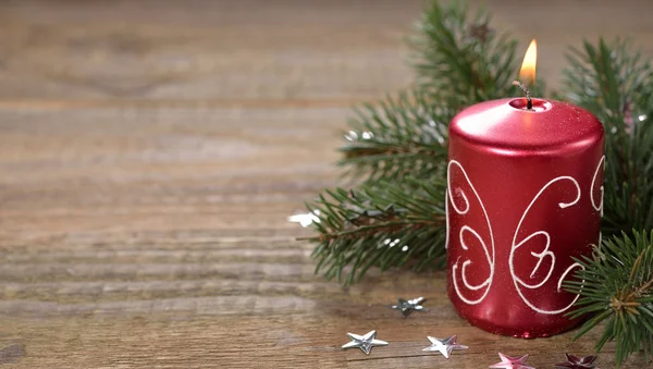 Burning Christmas candle — Stock Photo, Image