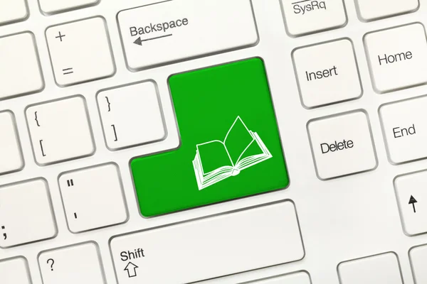 Weiße konzeptionelle Tastatur - grüne Taste mit Buchsymbol — Stockfoto