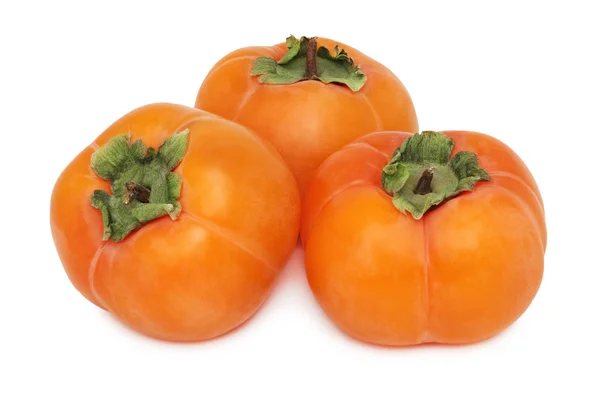 Trzech persimmons cała (na białym tle) — Zdjęcie stockowe