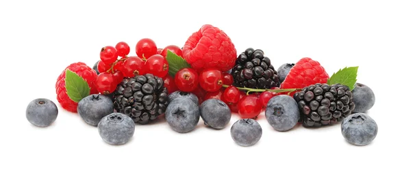Stack of different berries with green leaves (isolated) — Stock Photo, Image