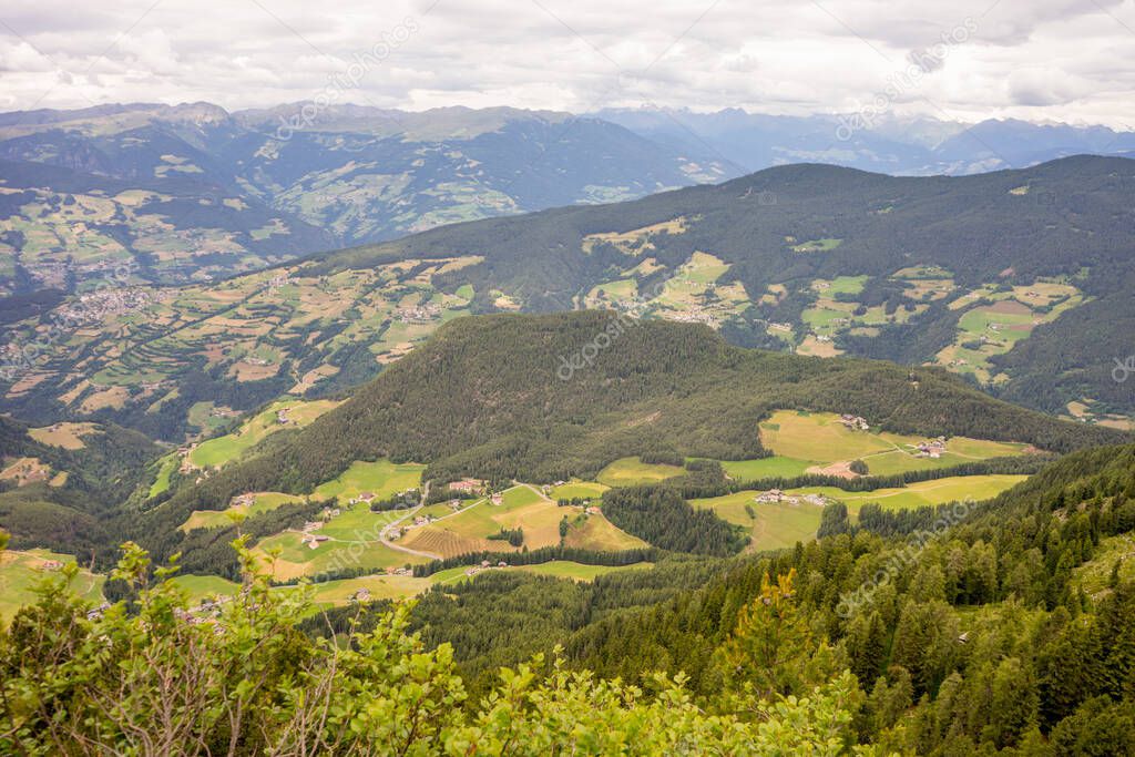 Italy, Alpe di Siusi, Seiser Alm with Sassolungo Langkofel Dolomite, a view of a large mountain in the background