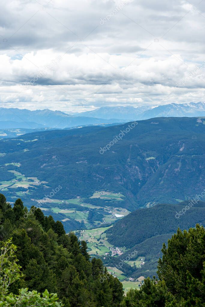 Italy, Alpe di Siusi, Seiser Alm with Sassolungo Langkofel Dolomite, a view of a large mountain in the background