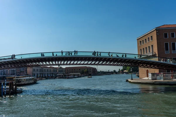 People walking on the bridge over the grand canal in Venice, Italy