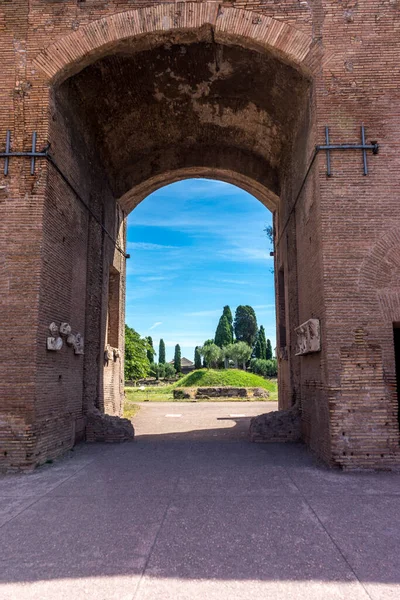 Italy, Rome, Roman Forum,  an arch welcoming into a garden