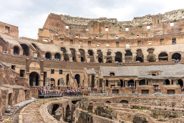 Rome, Italy - 23 June 2018: Interior of the Roman Colosseum (Coliseum, Colosseo), also known as the Flavian Amphitheatre. Famous world landmark. Scenic urban landscape.