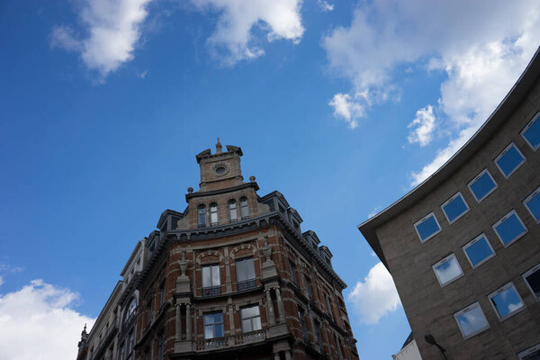 A gable on a old building in Brussels, Belgium with a blue sky