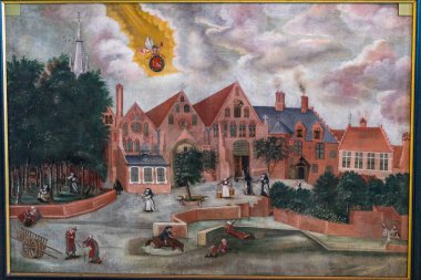 Brugge, Belçika - 17 Nisan: Kırmızı top taşıyan ve Sint-Janshospitaal Brugge, Belçika, Avrupa 'da tatil yapan bir meleğin resmi