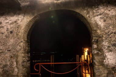 Europe, Italy, Varenna, Lake Como, a tunnel in a dark room clipart