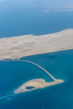 Dubai Emirates Desert, a view of water and a mountain in the background clipart