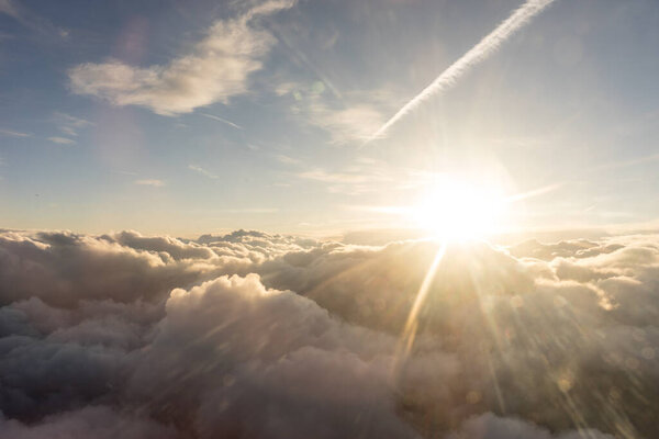 View of clouds from airplane window, a group of clouds in the sky