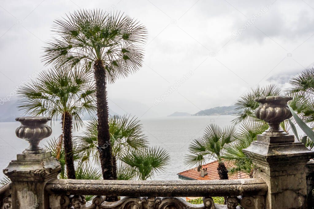 Europe, Italy, Varenna, Lake Como, a group of palm trees on the side of a building