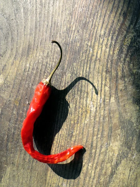 Red cayenne pepper on wood — Stock Photo, Image