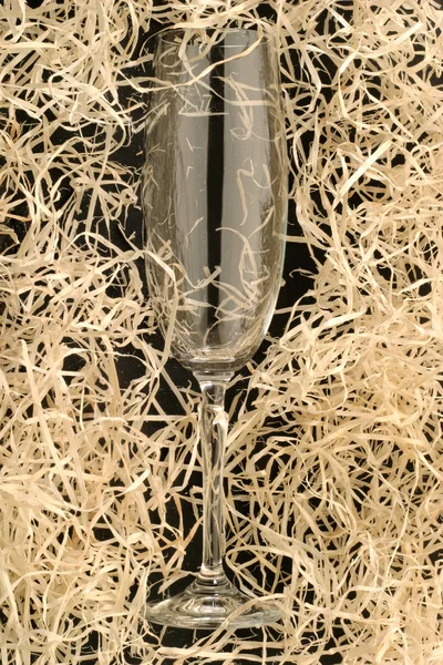 Glass in straw — Stock Photo, Image