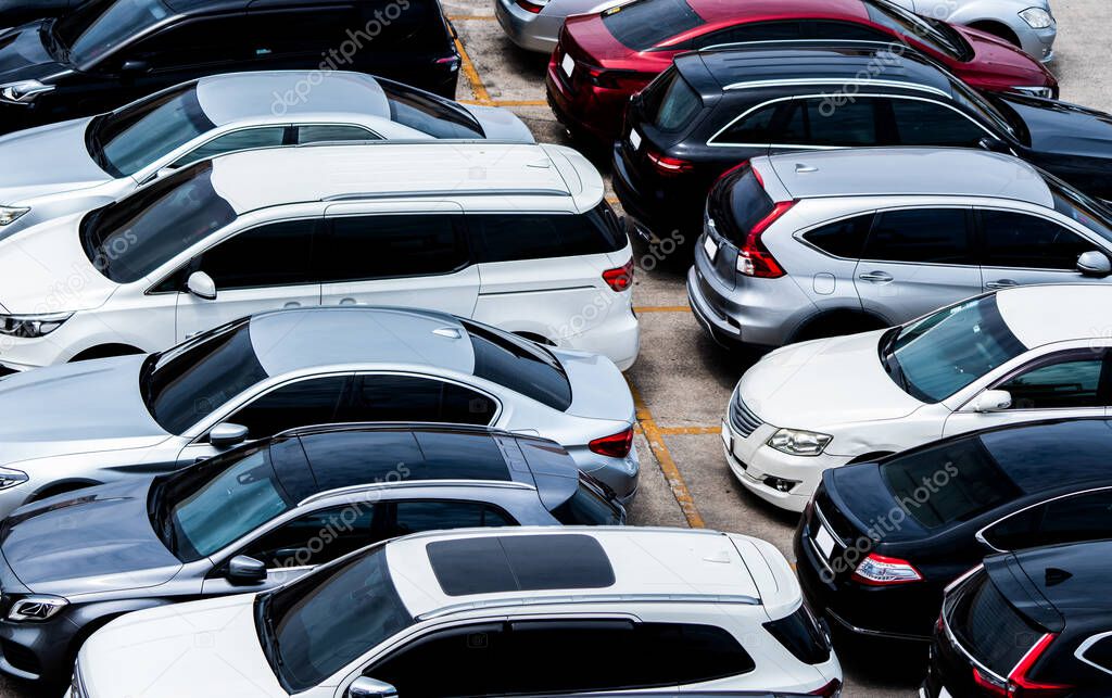 Car parked at parking lot of the airport for rental. Aerial view of car parking lot of the airport. Used luxury car for sale and rental service. Automobile parking space. Car dealership concept.