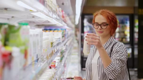 Attractive Redhead Girl Eyeglasses Dressed Casual Wear Choosing Goods Dairy — Stock Video