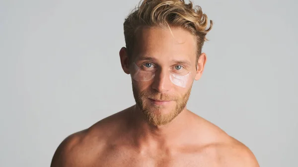 Handsome Blond Bearded Man Eye Patches Take Care His Skin — Stock Photo, Image