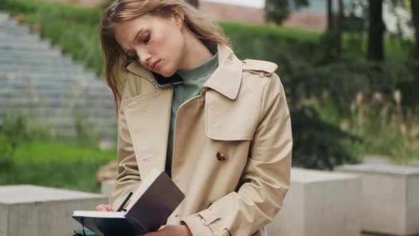 Beautiful Student Girl Talking Phone Friend Doing Homework College Bench — Stock Video