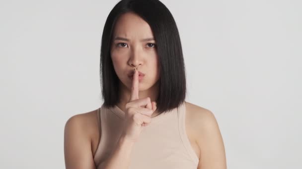 Young Asian Woman Looking Serious Asking Quiet Camera White Background — Stock Video