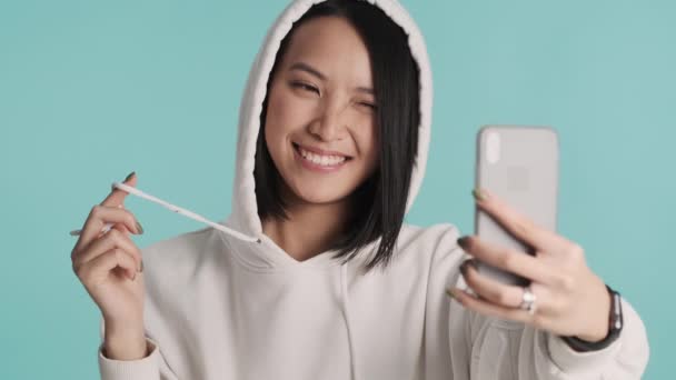 Beautiful Cute Asian Girl Wearing Hood Taking Selfie Social Networks — Stock Video