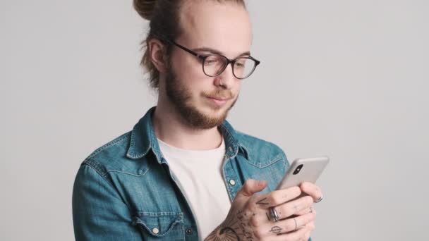 Young Bearded Man Eyeglasses Chatting Online Working Smartphone Isolated White — Stock Video