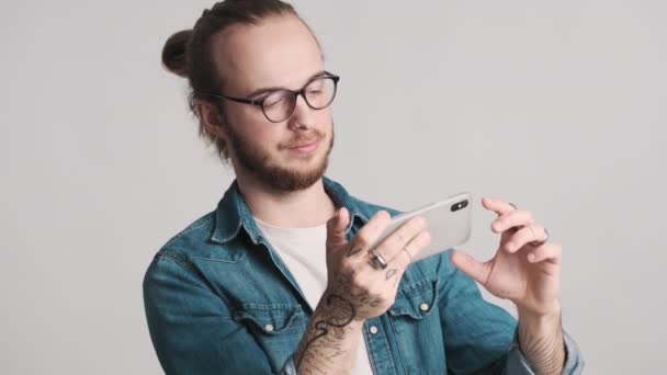 Young Bearded Man Wearing Eyeglasses Making Screenshot Smartphone White Background — Stock Video