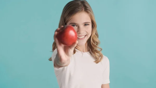 Portrait Pretty Blond Teenager Girl Offering Red Apple Smiling Isolated — 스톡 사진