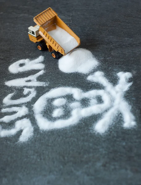 Model of big mining dump-body truck with skull of white sugar — Stock Photo, Image