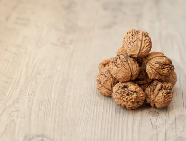 Wallnuts on vintage wooden table — Stock Photo, Image