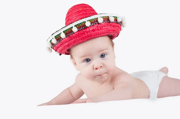 Cheerful little boy with a sombrero and maracas on a white background — Stock Photo, Image