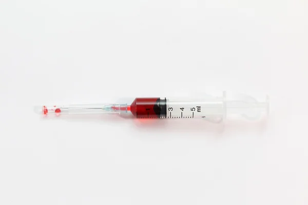 Red medicine syringe — Stock Photo, Image