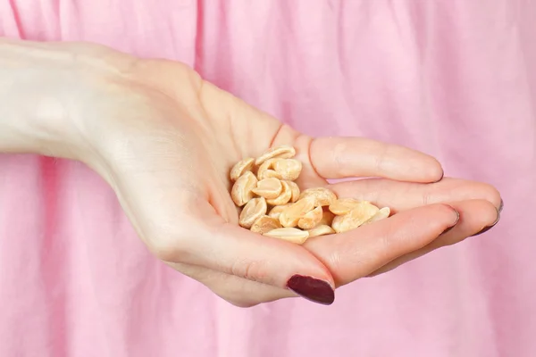 Peanuts in hand — Stock Photo, Image