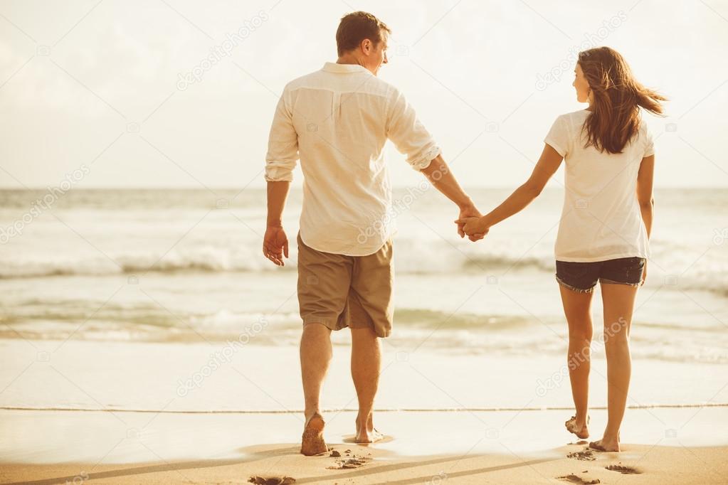 Romantic Couple on the Beach at Sunset. 